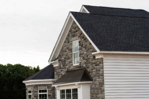 Top roof colors in Shreveport, such as charcoal gray, weathered wood, and brown, seen on local homes.