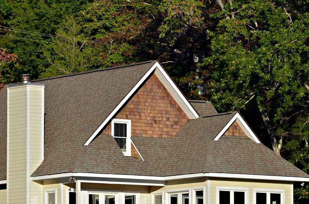 Top roof colors in Shreveport, such as charcoal gray, weathered wood, and brown, seen on local homes.