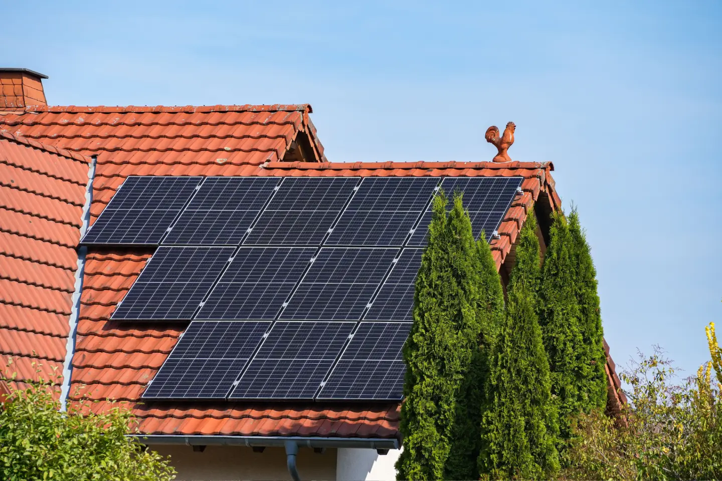 Residential Solar Panel Installation on Tile Roof Solar panels installed on red tile residential roof