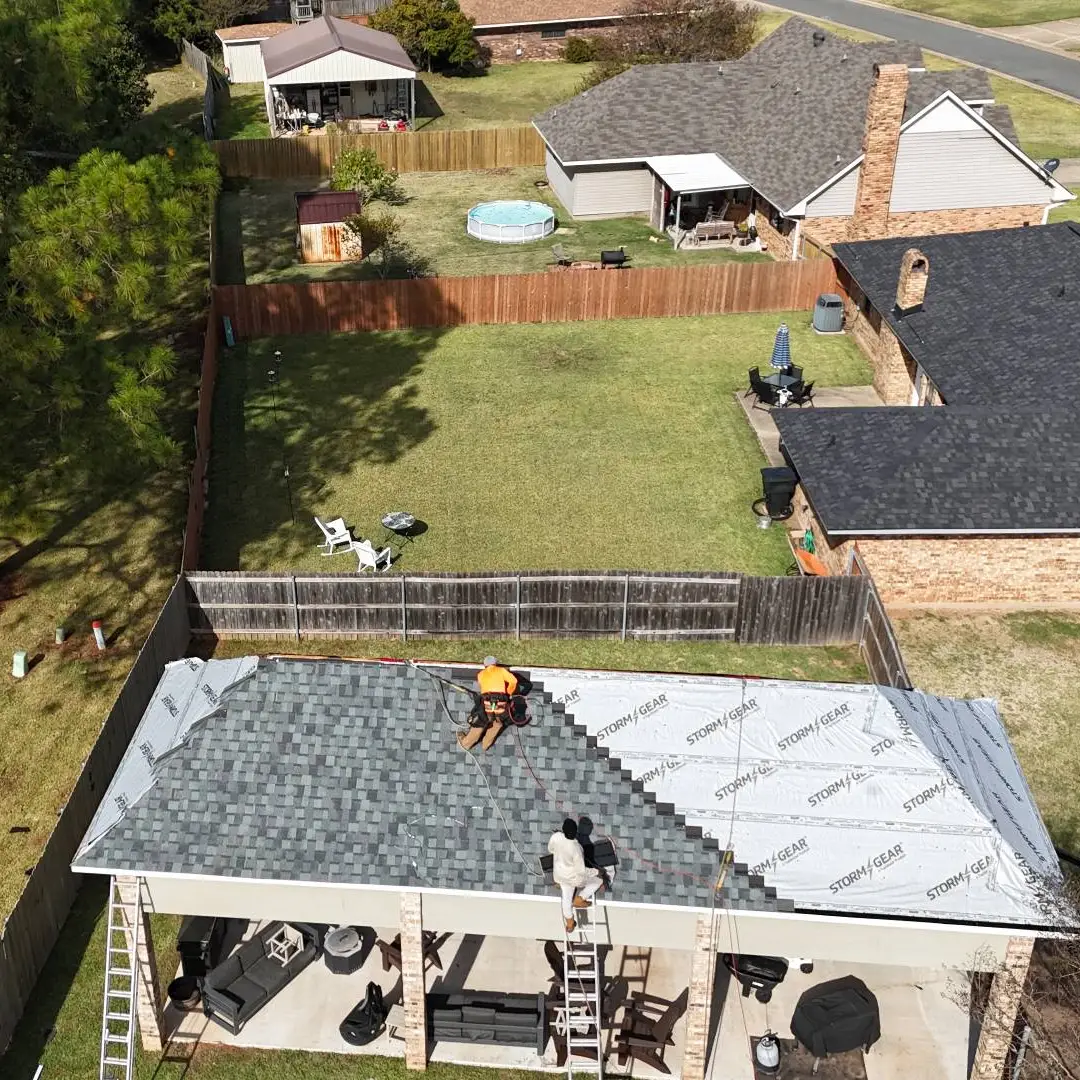 Residential Roofing Process Roofing company installing shingles on residential roof